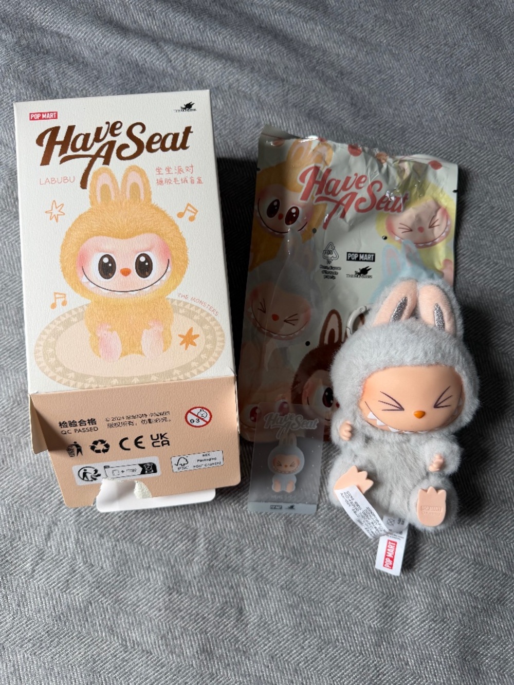 AUTHENTIC Pop Mart Labubu Have a Seat - HEHE (Grey)